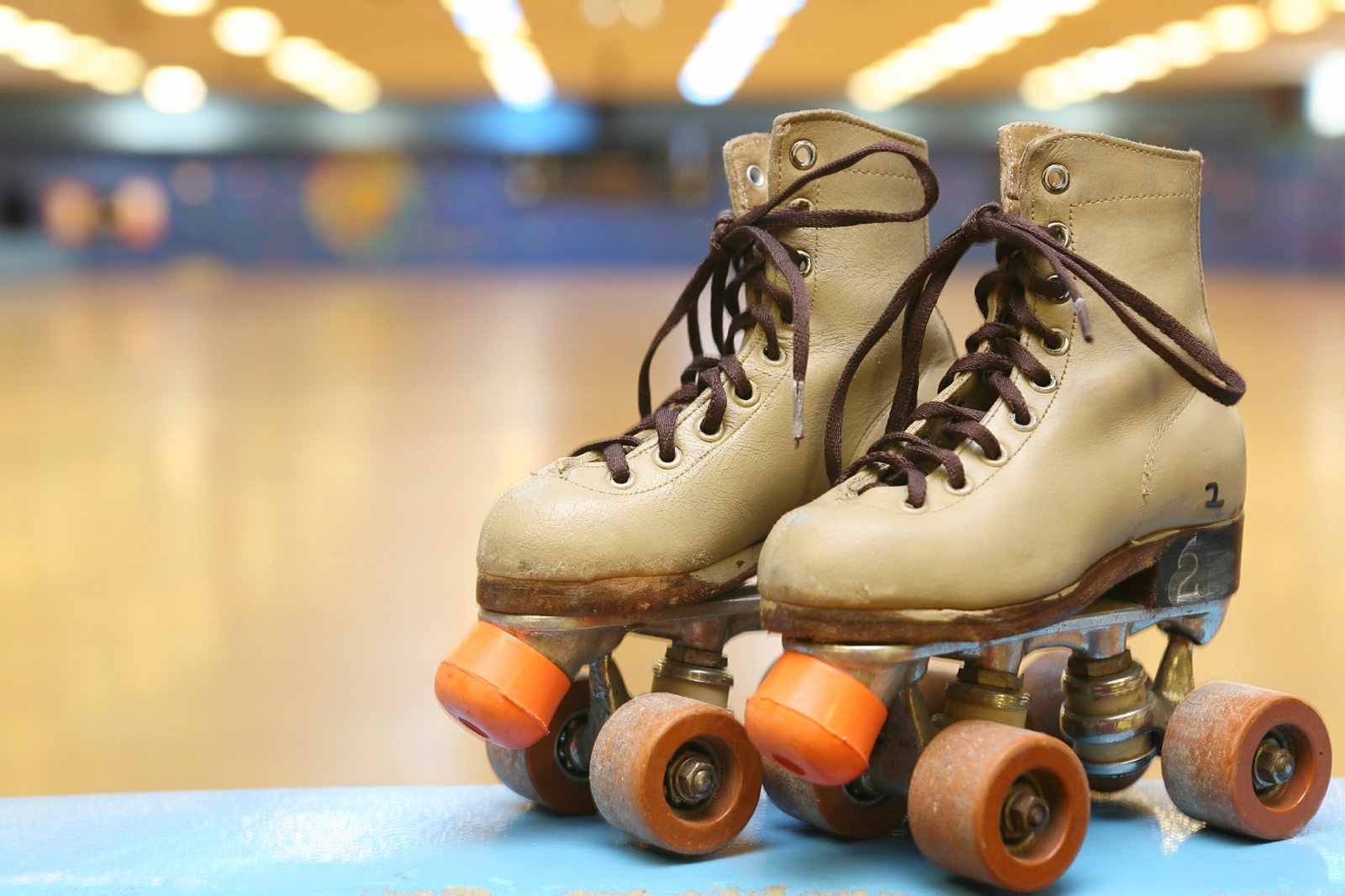 A pair of classic roller skates at a skating rink